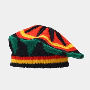 Detailed top view of a Rasta knit beret with signature red yellow and green leaf pattern