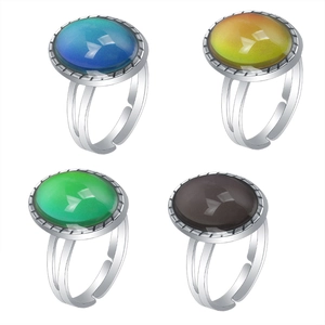 Set of four adjustable retro gemstone color-changing rings in diverse oval crystal hues