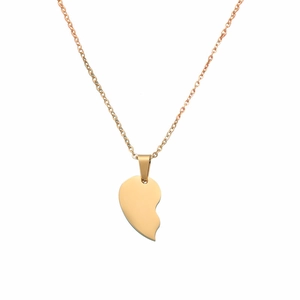 Detailed close-up of golden stainless steel split heart pendant on a delicate cable chain