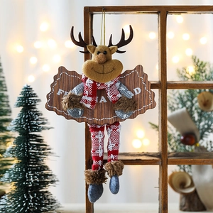 Hanging Christmas reindeer plush decoration with Feliz Navidad text and festive wood accents