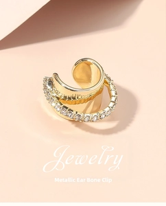 Detailed view of double row micro-pave rhinestone ear cuff in polished gold finish
