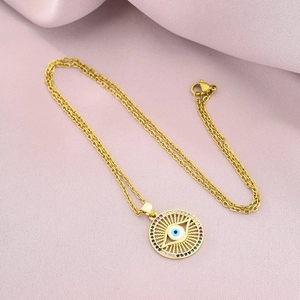 Detailed macro of a 18K gold-plated Evil Eye pendant with colorful zircon stones