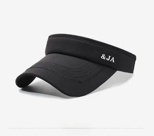 Detail of black sun visor hat with white NY&JA embroidery and breathable mesh fabric