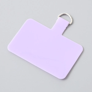 Close-up of lavender TPU phone lanyard patch with a silver metal D-ring attachment