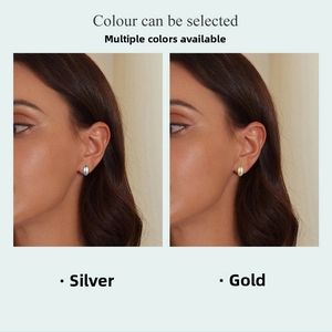 Comparison of minimalist oval stud earrings in polished silver and gold metallic finishes