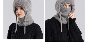 Detailed view of the grey knitted winter hat and fleece neck gaiter for windproof protection