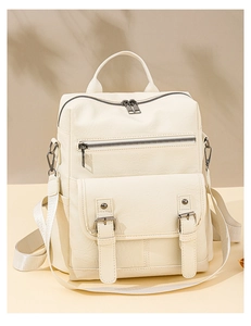 Detail view of cream soft PU leather backpack with vintage fringe and multi-pocket design