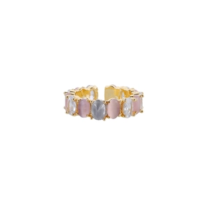 Detailed view of adjustable gold ring featuring pink cat eye stone and cubic zirconia