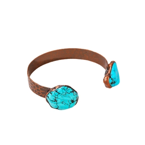 Vintage adjustable bronze bangle featuring turquoise stones and hammered metal texture