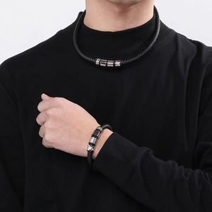 Men's black braided leather jewelry set with textured magnetic metal buckles
