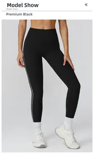 Detail of high waist yoga leggings in premium black with white side contrast stripes