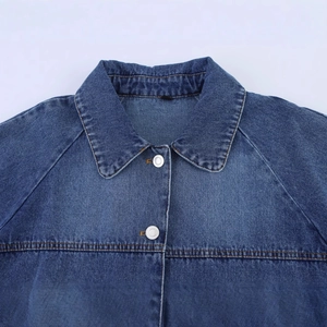 Blue denim cape jacket featuring a lapel collar and silver metal buttons with yellow stitching
