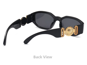 Detail view of small frame retro sunglasses featuring a gold circular relief on temples