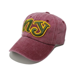 Close-up of vintage washed cotton baseball cap with multi-layer NY patch embroidery