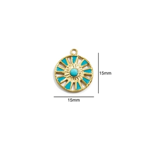 Macro detail of 15mm 14k gold compass pendant with turquoise stone inlay for DIY necklace
