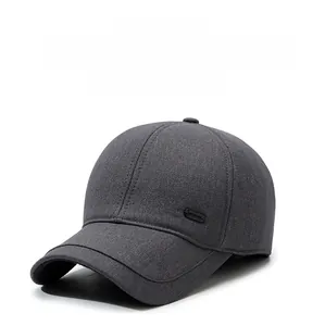 Detail view of a gray winter baseball cap showing thick warm fabric and ear protection