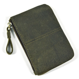 Detailed view of dark green crazy horse leather coin pouch with bronze metal zipper