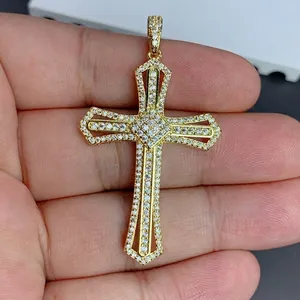 Detailed view of gold cross pendant with clear cubic zirconia, size 33x44.5mm