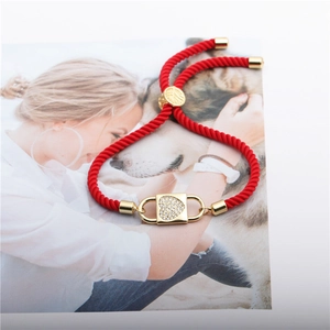 Adjustable red rope bracelet featuring a gold heart-shaped zircon lock pendant charm