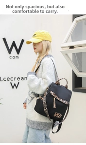 Outdoor shot of stylish leopard print oxford backpack with tassel detail on model