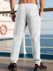 Men's white waffle joggers with grey diamond geometric patterns and rear pocket detail