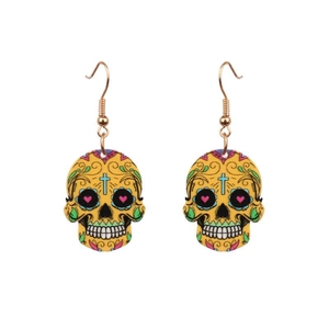 Detail of yellow skull earrings with colorful floral patterns and golden metal hooks