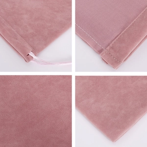 Detail view of pink velvet drawstring pouch showing stitching and fabric texture