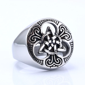 Vintage stainless steel signet ring for men with Celtic knot leaf relief on white background