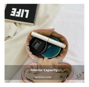 Interior view of small pink quilted chain bag showing capacity for cosmetics and lipsticks
