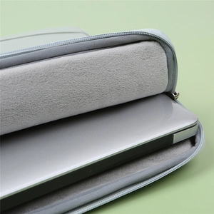 Gray laptop sleeve with soft plush lining for shockproof protection and minimalist design