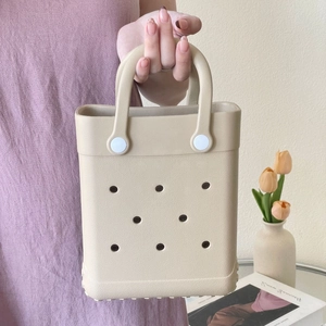 Detailed view of lightweight EVA tote bag with perforated hole design in beige color