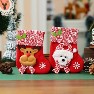 Red knit Christmas stockings featuring 3D reindeer and polar bear ornaments for decor