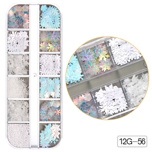 Close-up of 12-grid box with snowflake glitters and sequins for Christmas nail art decor
