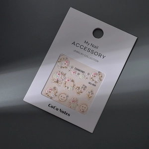 Detail of 3D embossed floral nail stickers with pearls and cherry blossoms in MJ-068 packaging