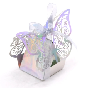Detail of laser-cut butterfly gift box with holographic finish and purple ribbon bow