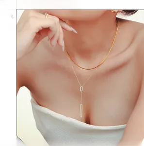 Detail of double-layer 18K gold-plated necklace with zircon-encrusted rectangle pendant
