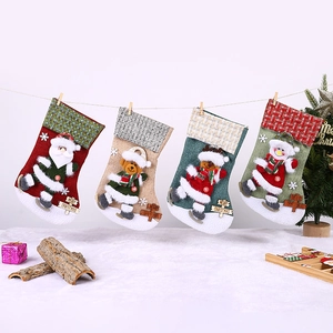 Set of four cartoon Christmas stockings with Santa, bear and snowman on festive background