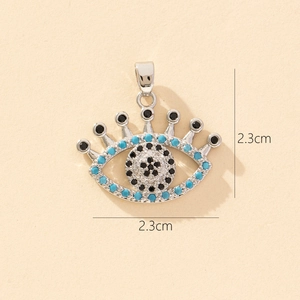 Detail of evil eye pendant with turquoise beads and black rhinestones, size 2.3cm