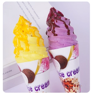 Detailed view of PU foam ice cream models with vibrant swirl cream and fruit jam drippings