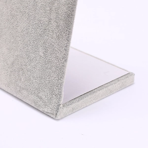 Detail of the L-shaped grey velvet jewelry display stand base and surface connection