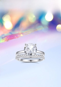 Macro shot of 925 silver bridal ring set with sparkling 2ct round cut center stone