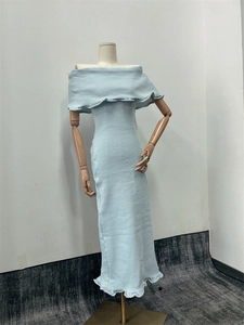 Front view of light blue off-shoulder knitted dress on mannequin with textured fabric detail
