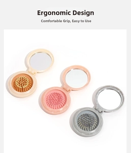 Detail of portable marble-pattern folding hairbrush with integrated round mirror