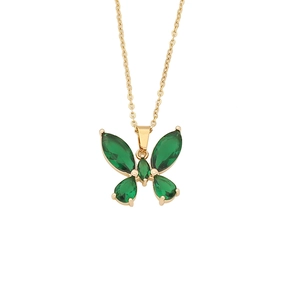 Elegant gold butterfly necklace with emerald green gemstones on a white background