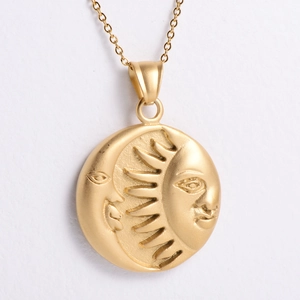 Close-up of vintage sun and moon embossed 18K gold plated necklace with matte finish
