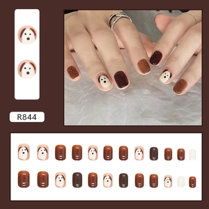 Cute puppy press-on nail set in brown and beige tones featuring short square nail tips