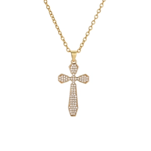 Macro detail of gold plated cross pendant with cubic zirconia stones on link chain