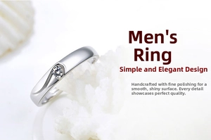 Macro view of men's silver plated engagement ring featuring a minimalist wave setting