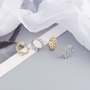 Close-up of S925 sterling silver chain link hoop earrings in gold and silver finishes