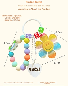Detail of beaded sunflower keychain showing 1.1cm thickness and 32.1g lightweight design